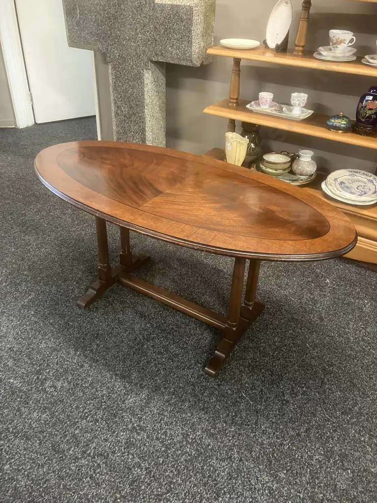 Vintage Oval Banded Flame Mahogany Coffee Table With A  Double Column Trestle Base And Stretcher. H51 L112 W56cm Image 1++