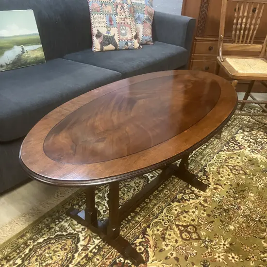 Vintage Oval Banded Flame Mahogany Coffee Table With A  Double Column Trestle Base And Stretcher. H51 L112 W56cm