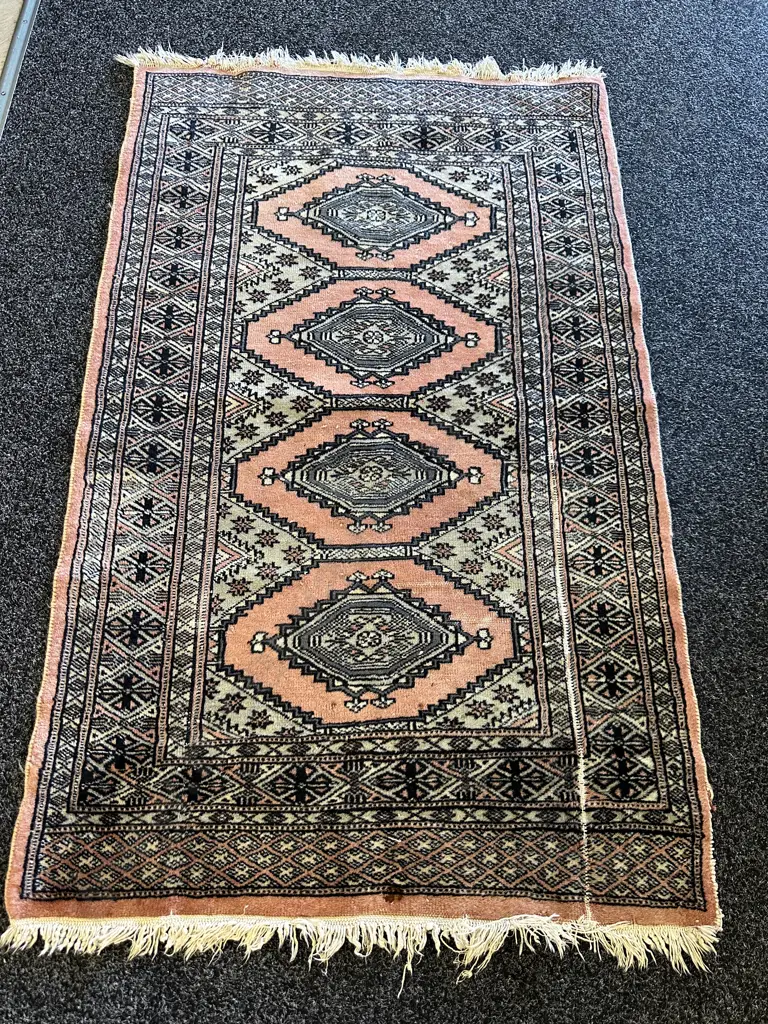 Vintage Hand Knotted Floor Rug With A Distinctive Salmon Pink Background Geometric Diamond & Medallion Motifs 122x76cm.  Image 1++
