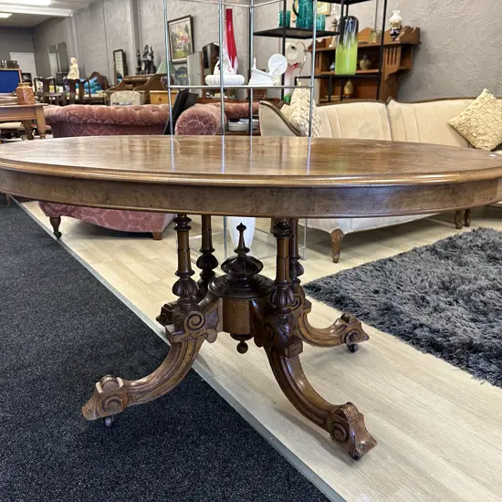 Heavily carved oval Ornate Burr Walnut Quad Pedestal Lou Table. Original castors, brass latches H74 L135 W100