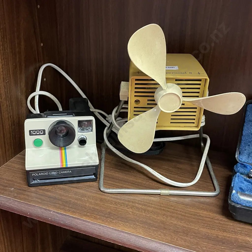 Vintage Polaroid Land Camera with Retro Ralta Desk Fan Image 1++