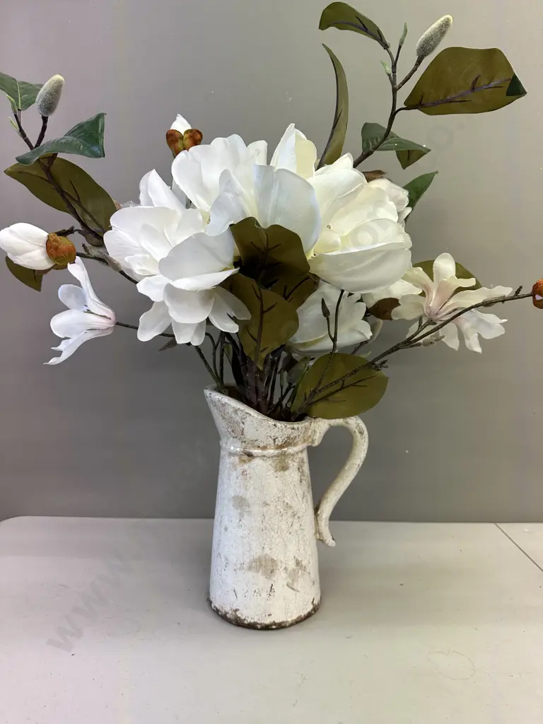 Faux Flowers In Decorative Jug Image 1++