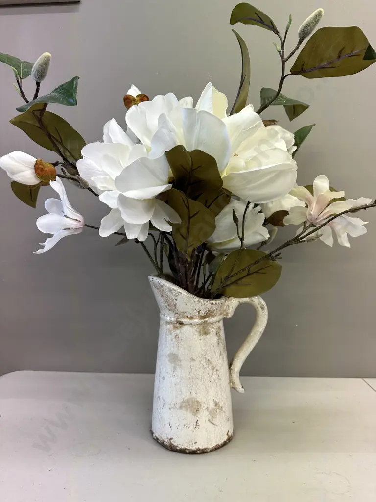 Faux Flowers In Decorative Jug Image 1++