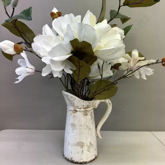 Faux Flowers In Decorative Jug