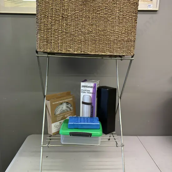 Wicker Basket With Assorted Picnic Items And Folding Metal Stand