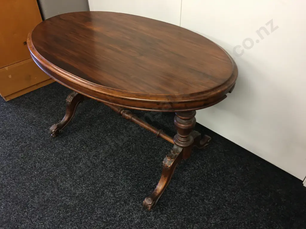 Antique Oval Kauri Centre Table, Carved Legs With Turned Shaped Stretcher, Bakelite Castors, H64 W106 D65cm Image 1++