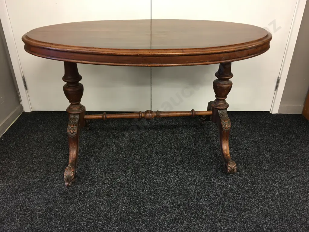 Antique Oval Kauri Centre Table, Carved Legs With Turned Shaped Stretcher, Bakelite Castors, H64 W106 D65cm Image 1++