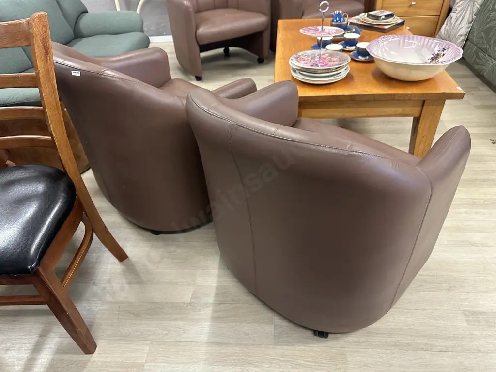 Pair of Brown Leather Tub Chairs On Castors Image 1++