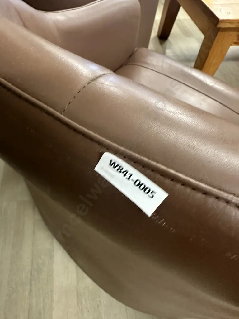 Pair of Brown Leather Tub Chairs On Castors Image 1++
