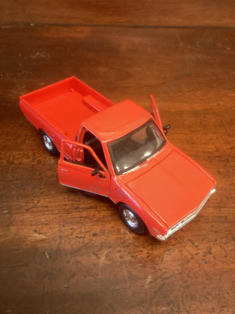 Maisto 1973 Datsun 620 Pickup, Red Collectors Edition 1:24 Diecast With Opening Doors Image 1++