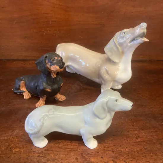Lot of 3 Dachshund Figurines. 15 x 25 to 8 x 15cm