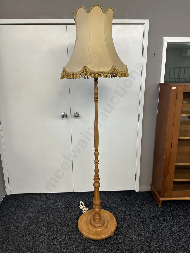 Turned Rimu Pedestal Lamp With a Gold Colour Tasselled Fabric Shade. H195cm Image 1++