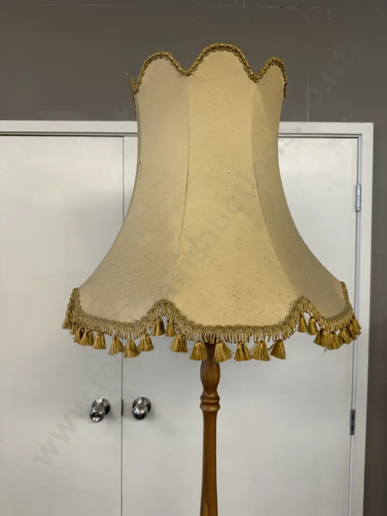 Turned Rimu Pedestal Lamp With a Gold Colour Tasselled Fabric Shade. H195cm Image 1++