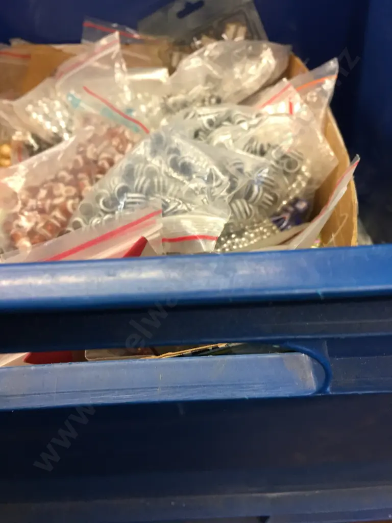   Large Selection Of Beads In Navy Blue Storage Bin Image 1++