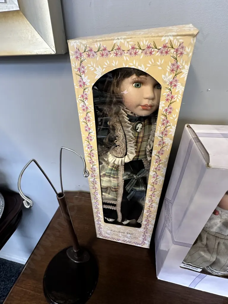 Three Boxed Porcelain Dolls With a Stand Image 1++