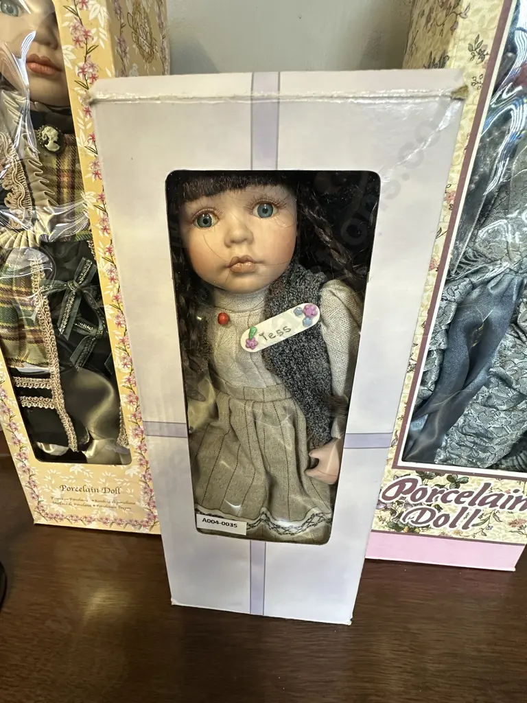 Three Boxed Porcelain Dolls With a Stand Image 1++