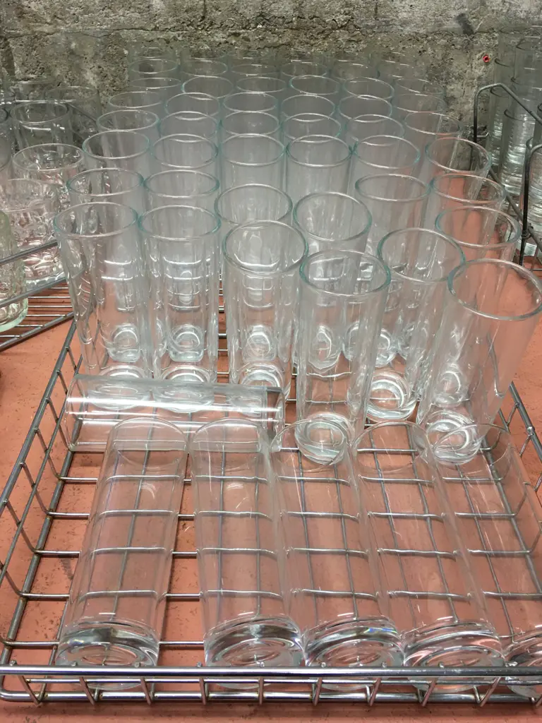 Two Trays Of Tall Glasses In Steel Trays Image 1++