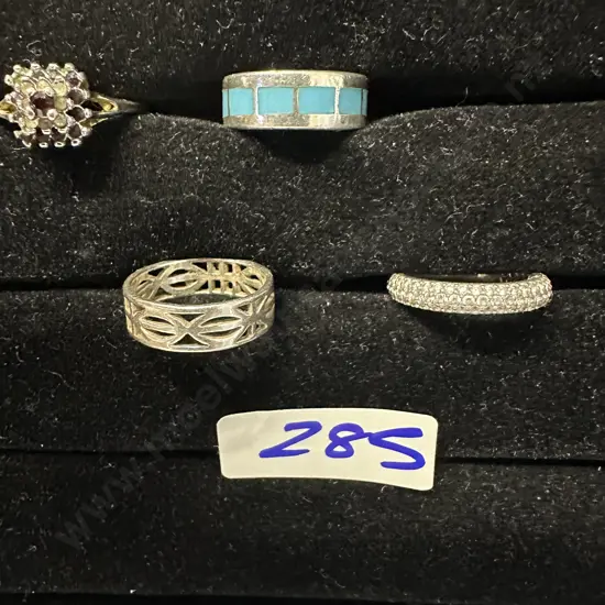 Assorted Rings On Black Display Stand