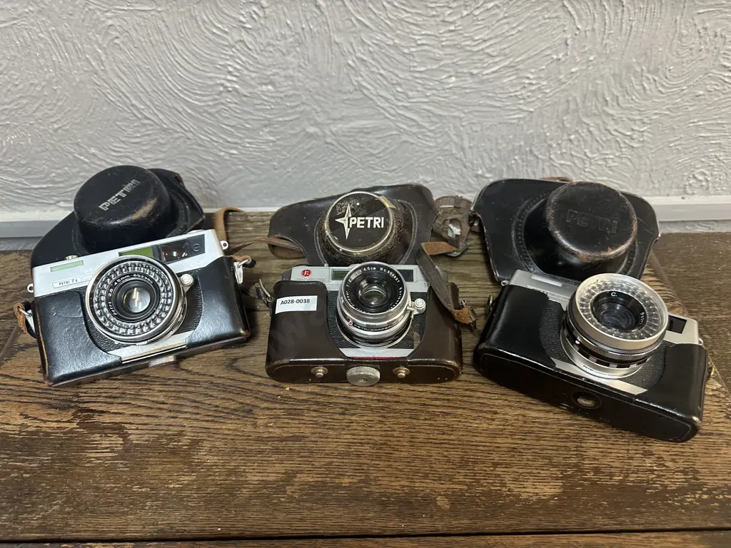 Pair of Petri 7S 35mm Film Cameras 60's Japan 2.8/45mm Circle Eye System Lens, Petri SK With 1.28/45mm, Leather Cases Image 1++
