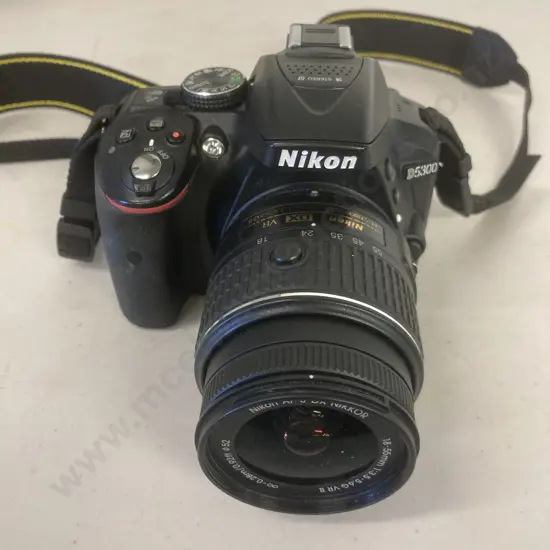 Nikon D5300 DSLR Camera #4519417 With AF-S DX Nikkor 18-55mm 1:3.5-5.6G VR II Lens With Strap (No Charger)