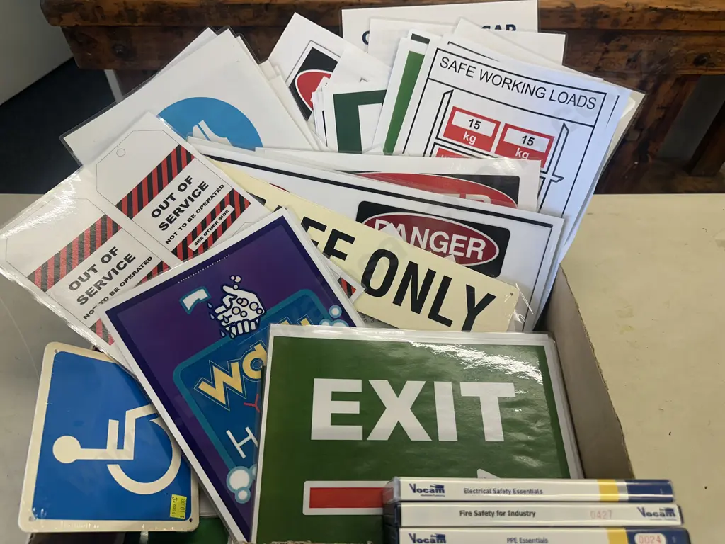 Large Selection of Laminated Safety Signs & Assorted DVDs Image 1++