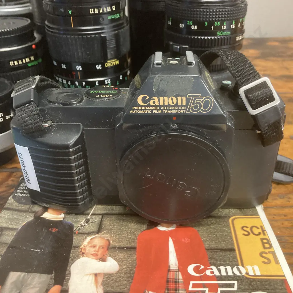 Canon T50 SLR Camera #2410225, FD Lenses - Zoom 35-105mm f/3.5, 24mm f/2.8,300mm f/5.6, 50mm f/1.8, 35-70mm f/3.5-4.5 Image 1++