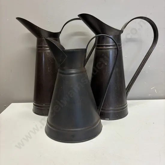 Three Metal Pitchers H34cm x 2 and H27cm