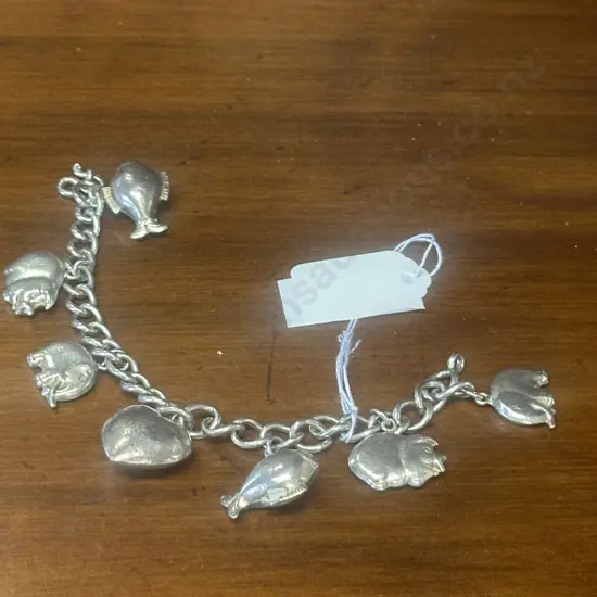 Silver Coloured Charm Bracelet Including Elephants,Pig Charms Etc