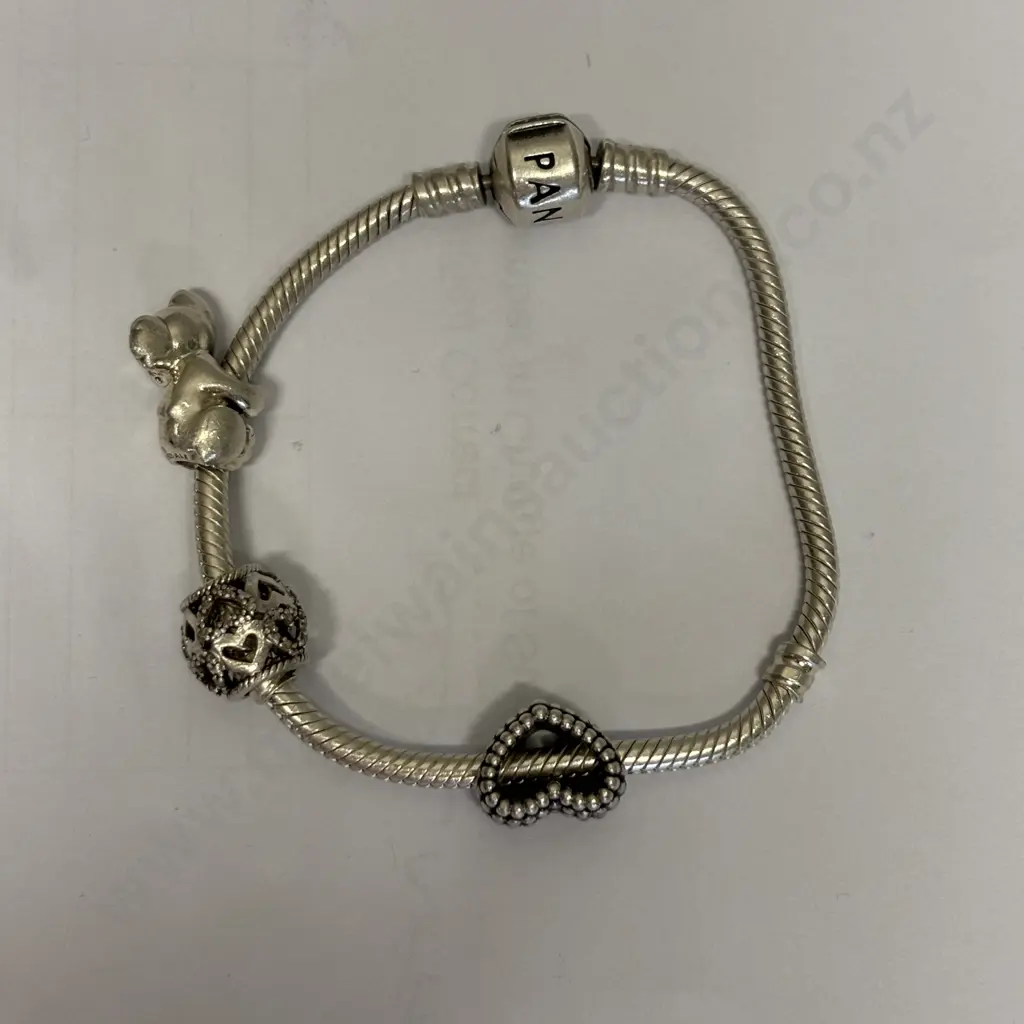 Sterling Silver Pandora Bracelet with 3 charms. Stamped 925 Image 1++