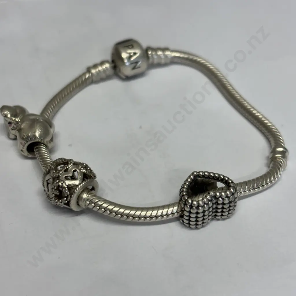 Sterling Silver Pandora Bracelet with 3 charms. Stamped 925 Image 1++