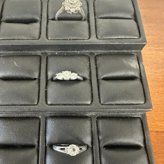 Three Silver Coloured Rings With Clear Stone 
