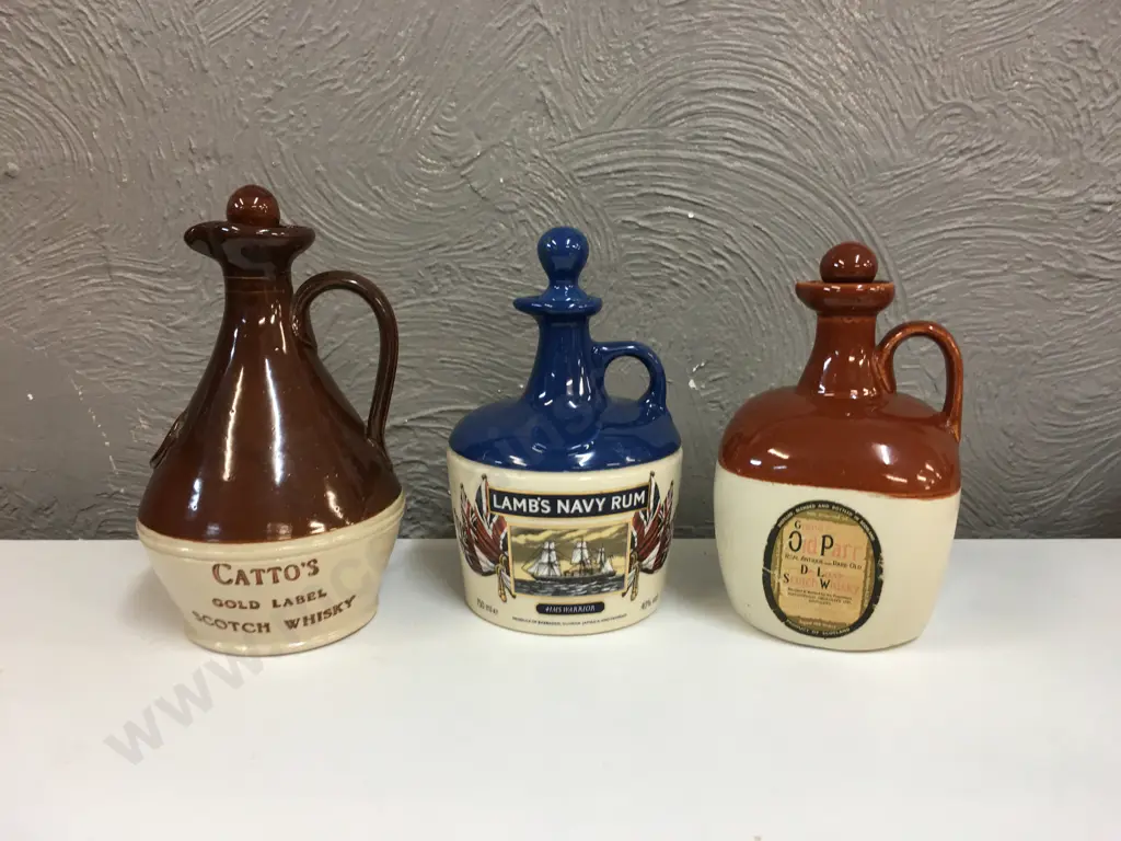 Selection Of Whiskey & Rum Stoneware Bottles Including Grand Parr, Cattos & Lambs Navy Rum Image 1++