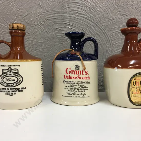 Selection Of Whiskey & Port Stoneware Bottles Including Grand Parr, Grants & Brown Brothers Port