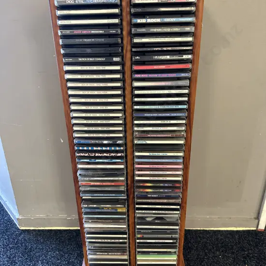 Wooden CD Rack With Assorted CDs Including Jessica Simpson, Box Of Rock Etc
