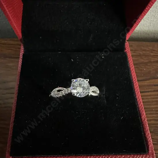 Ladies Ring Silver Coloured With Clear Stones In Red Case