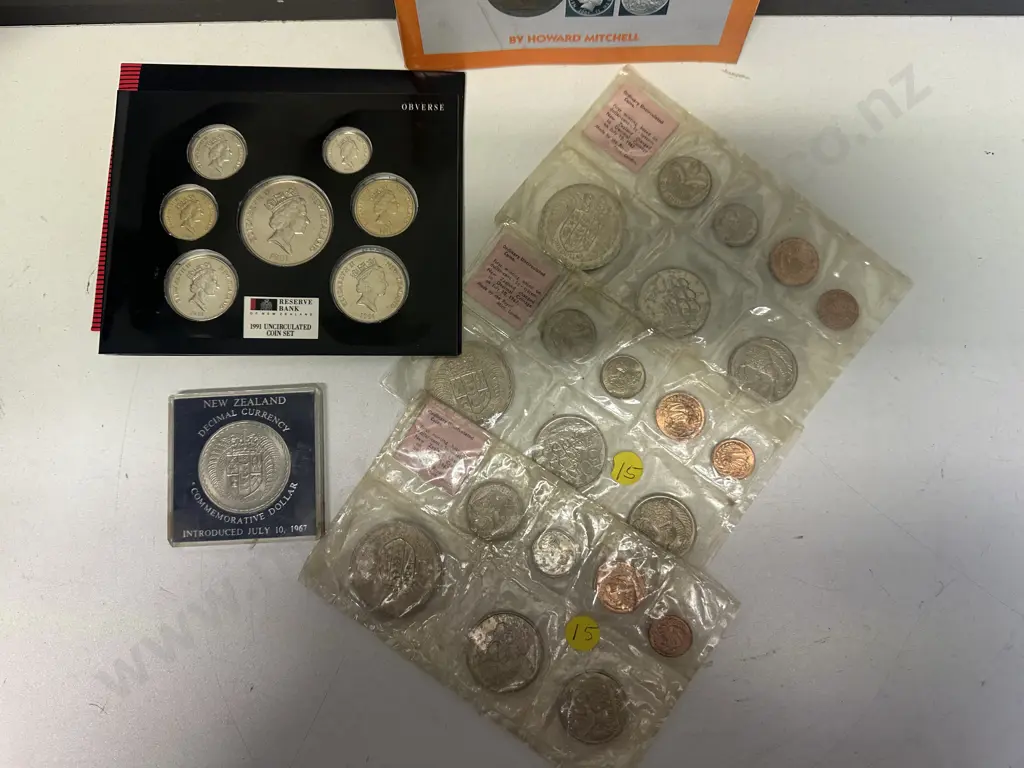 Selection Of Coins Including Rugby World Cup 1991, Commemorative Dollar 1967, Coin Setsx3 & NZ Coin & Bank Note Booklet Image 1++