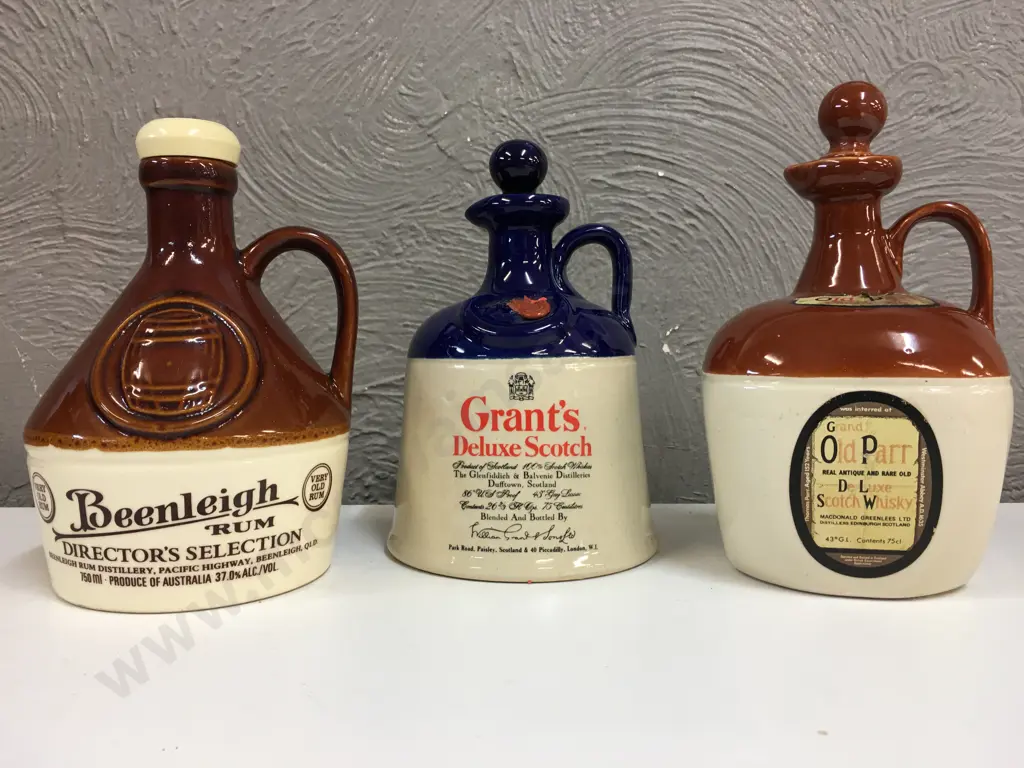 Selection Of Whiskey & Rum Stoneware Bottles Including Grand Old Parr, Grants & Beenleigh Rum Image 1++