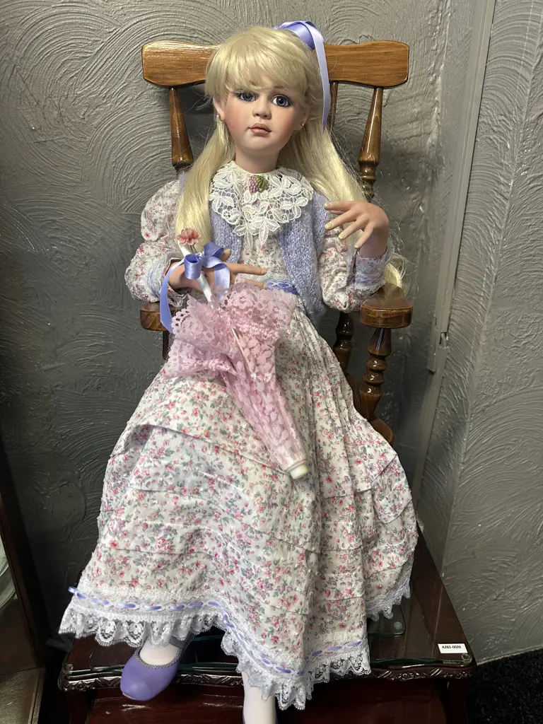 Vintage Porcelain Doll Sitting On Minature Colonial ChairWith Legs Crossed Dressed By Jan Mclean Designers Image 1++