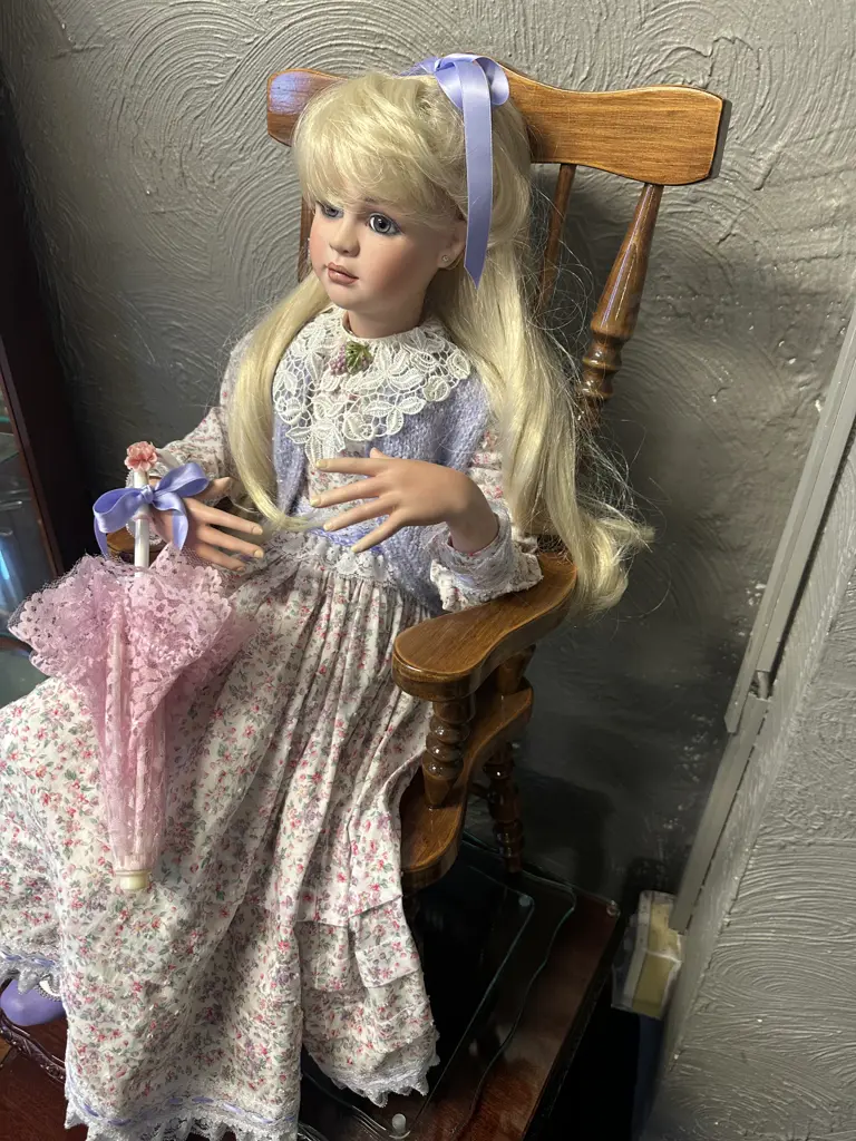 Vintage Porcelain Doll Sitting On Minature Colonial ChairWith Legs Crossed Dressed By Jan Mclean Designers Image 1++