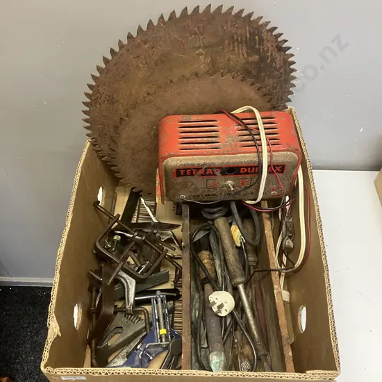 Box lot Vintage Solder Irons & Lead, Vintage Teerad Duplex Charger, Large Round Saw Blades Etc