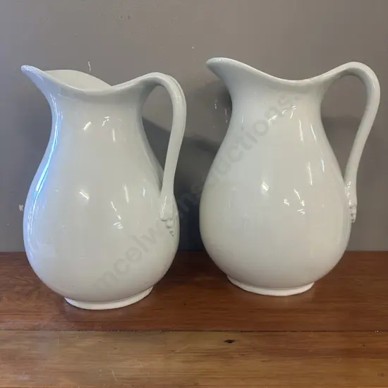 Pair Of White Porcelain Pitchers 28&29cm.