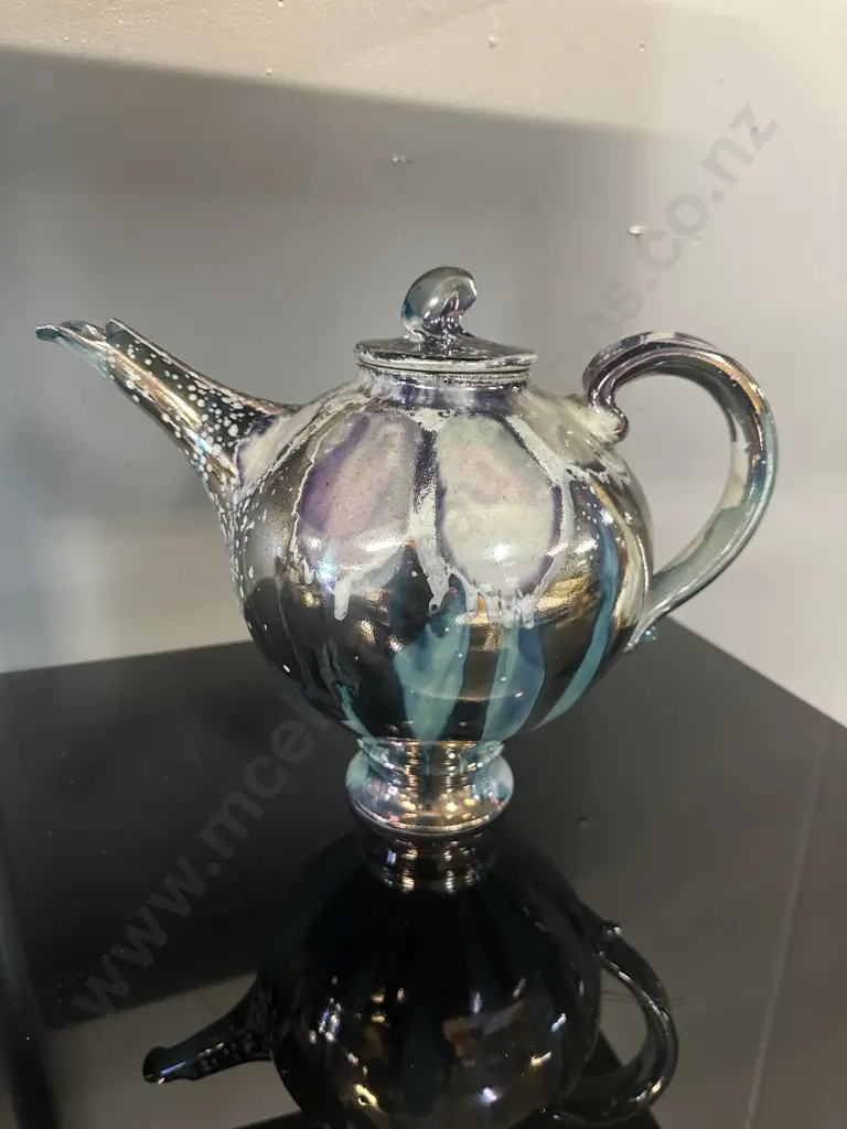 Decorative Teapot With Iridescent Metalic Glaze Reflecting Blue, Purple & Silver With A finial On Lid Image 1++