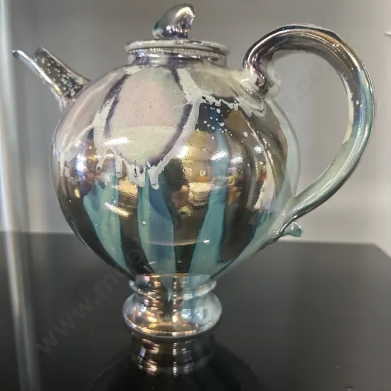 Decorative Teapot With Iridescent Metalic Glaze Reflecting Blue, Purple & Silver With A finial On Lid