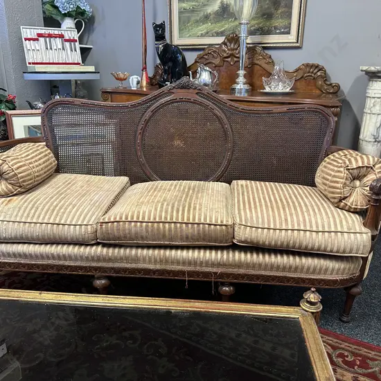 Bergere Cane Upholstered 3 Seater Sofa. 4 Legs In Front, Ornately Carved, Curved Arms (As Found)