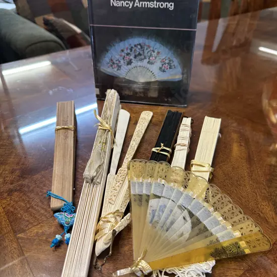 Selection of Vintage Fans With Book by Nancy Armstrong