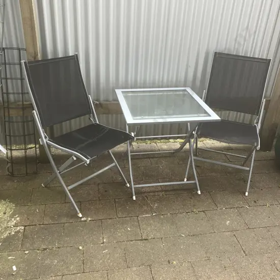 Steel & Glass Top Folding Patio Table With 2 Black Chairs