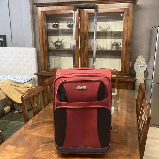 Voyager Red Small Wheeled Suitcase With Retracting Handle. Expanding. H58cm