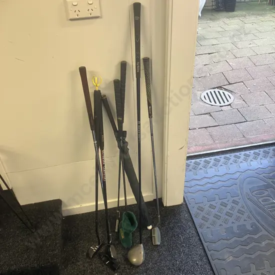 Assorted Golf Clubs With Drizzle Stick