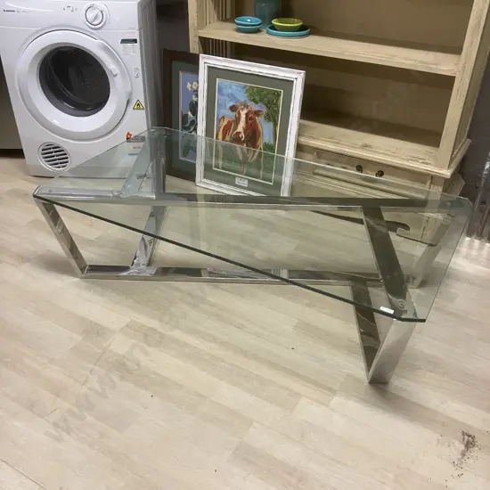 Polished Chrome Glass Topped Coffee Table. H34.5 W130 D70cm