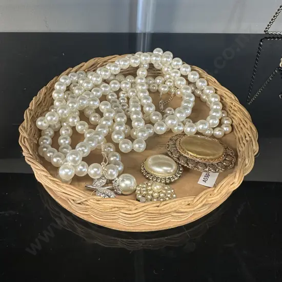 Vintage Brooches & Pearl Style Necklaces On Round Cane Tray